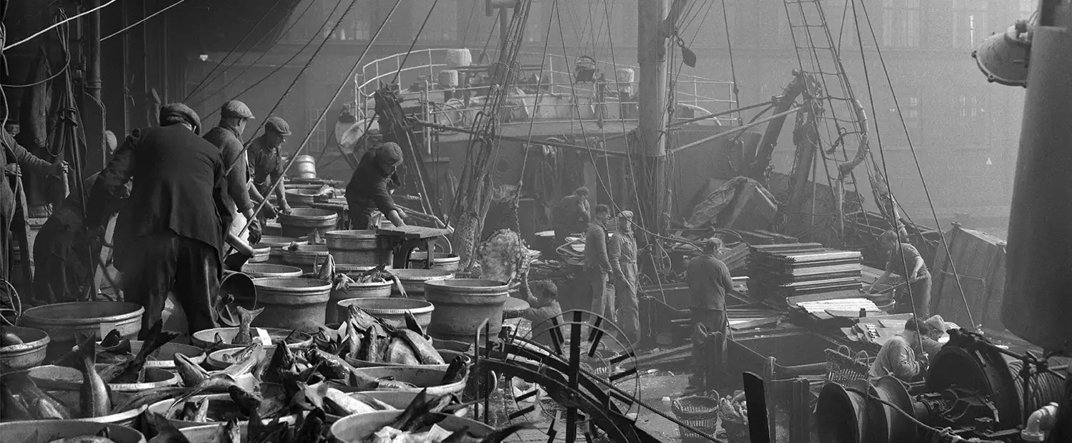 Black & white picture of workers on dock