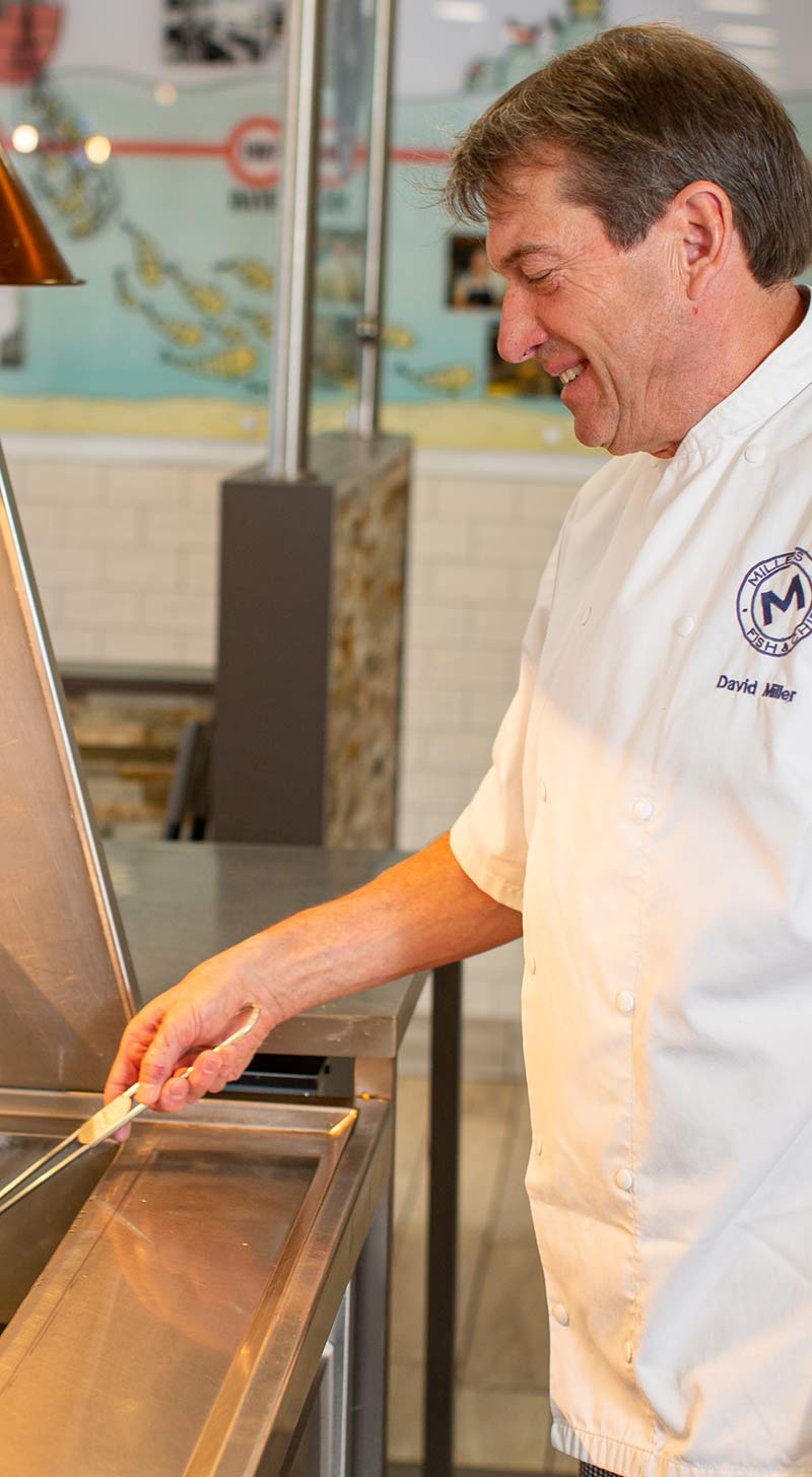 Man serving fish & chips